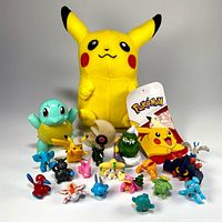 Group shot of Pikachu plush with all vinyl figures