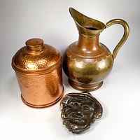 Group shot of pitcher, canister with lid, and ashtray
