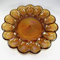 Front view showing amber iridescent deviled egg plate with 12 wells