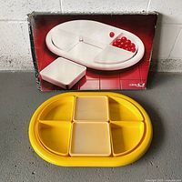 Tray displayed with original box showing product illustration