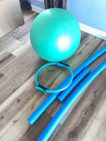 Group view of exercise ball, Pilates ring, three pool noodles