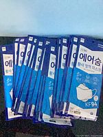 Front view showing multiple sealed blue Sejin Air-Soom KF94 mask packets