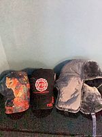 All three hats side by side