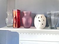 Five of the six vases on a mantle