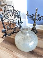 wine rack, glass vase, candelabra grouped