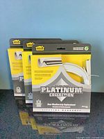 Three packaged M-D Platinum Collection door weatherstrips front view
