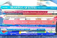 Stack of 12 quilting and craft books showing spines and titles