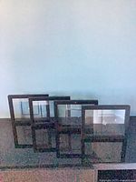 Five black metal frames front view