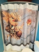 Shower curtain with fantasy figure and fish