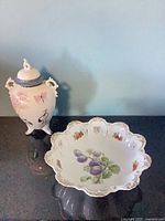 Urn and bowl side by side showing scale and decoration