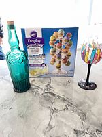 Front view of boxed Wilton cupcake stand