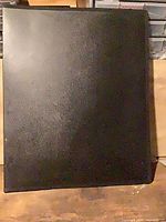 front cover of black portfolio