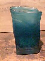 Full view of teal swirled square art glass vase