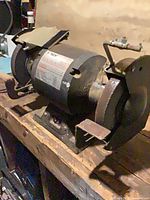 Full view of KMG bench grinder on workbench