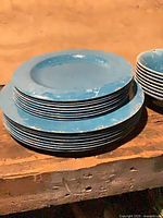 Stack of blue enamel dinner plates