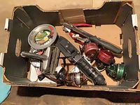 Box containing reels, knife, scaler, line spool