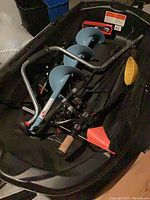 Overall view of sled containing auger, skimmer, rod, tip-up