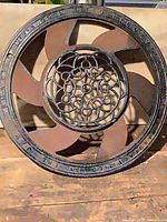 Full view of cast iron register showing damper and decorative grille