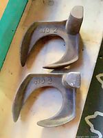 Top view of both cast iron implements showing NO 2 marking