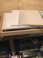 Stack of blank canvases on table