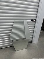 Mirror front showing hexagonal shape and reflective surface