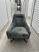 Front view of charcoal gray microfiber accent armchair showing seat and chrome base