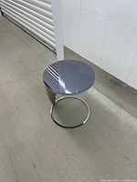 Top-down view of tempered glass top on chrome base