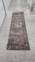 Dark oriental floral runner laid flat