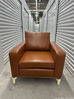 Front view of tan/cognac brown leather armchair