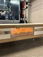 Front view showing flame display and drawer fronts