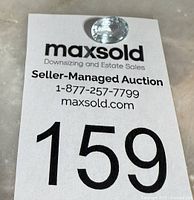 Aquamarine on MaxSold tag showing lot number