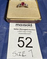 Ring in presentation box displaying size tag