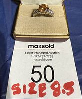Ring in box with lot card showing size 8.5