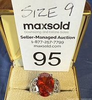 Front view of ring in box showing gemstone and size card