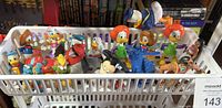 Basket filled with assorted Disney and other small toys