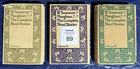 Front covers of the three volumes showing decorative borders and titles