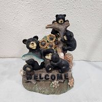 Front view of bear family welcome statue