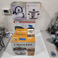 Stacked product boxes showing all four items