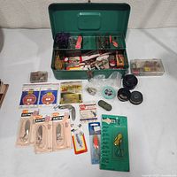 Open tackle box with all contents laid out