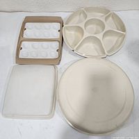 Round sectional serving tray, rectangular deviled-egg carrier with lid displayed together