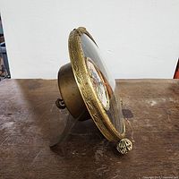 Angled rear-side view of clock body and bezel detail