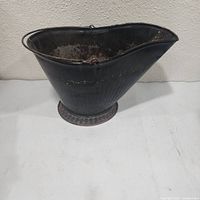 Front view showing full bucket profile and base