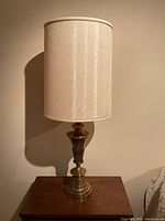 Full lamp on table, showing base and shade