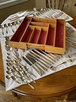 Overview of flatware laid out with bamboo tray centered