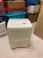 Front view of Whirlpool Gold dehumidifier showing intake grille and general appearance