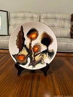 Front of enamel plate showing abstract design and color detail