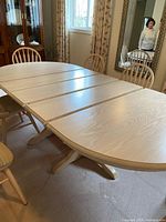 table fully extended with three leaves installed