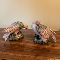 Front view of both ceramic doves on bases