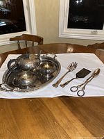 Full view of tea set on tray with utensils