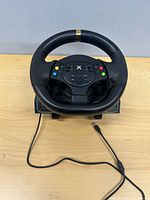 Front view of steering wheel with USB cable visible